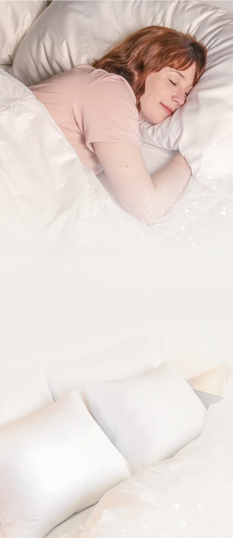 A person sleeping on white bedding, with a row of white pillows below